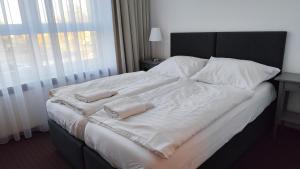 Postel nebo postele na pokoji v ubytování Mini Hotel Akord