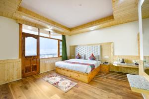 Postel nebo postele na pokoji v ubytování FabHotel Rigzin Nest Cottage