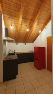 a kitchen with a red refrigerator in a room at Ferienwohnung AA-Waldhausen DG in Aalen