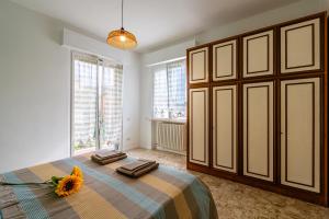 En eller flere senge i et værelse på Conero Holiday Home - "Il Girasole"