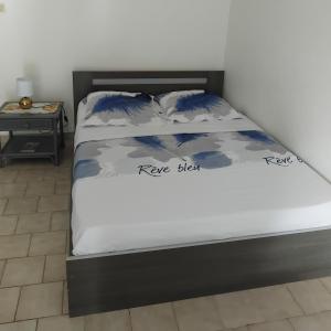 Postel nebo postele na pokoji v ubytování T1 Gardénia + 7 fotografií