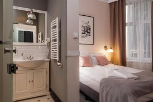 Posteľ alebo postele v izbe v ubytovaní Imagine Apartments