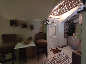 a room with a table and chairs and a door at Samy in Sarajevo
