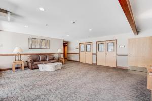 a living room with a couch and a table at River Mountain Lodge in Breckenridge