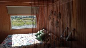 Postel nebo postele na pokoji v ubytování Fío Fío Patagonia