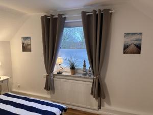 Postel nebo postele na pokoji v ubytování Ferienwohnung Deichblick