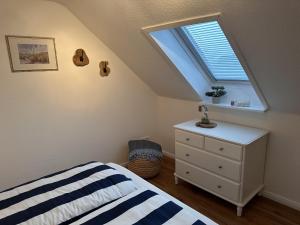 Postel nebo postele na pokoji v ubytování Ferienwohnung Deichblick