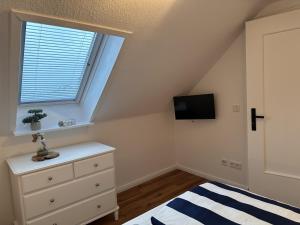 Postel nebo postele na pokoji v ubytování Ferienwohnung Deichblick
