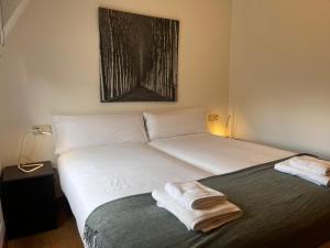 A bed or beds in a room at Centenario