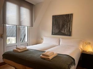 A bed or beds in a room at Centenario