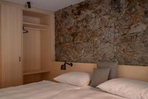 Postelja oz. postelje v sobi nastanitve Calva B&B Apartments