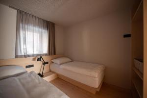 Postelja oz. postelje v sobi nastanitve Calva B&B Apartments