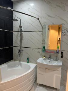 a white bathroom with a tub and a sink at Эксклюзивный Дом Самарканда in Samarkand +24 photos