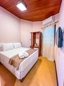Postel nebo postele na pokoji v ubytování Balanço do Mar Rooms
