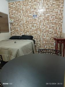 En eller flere senge i et værelse på Loft da Praia + 1 billede