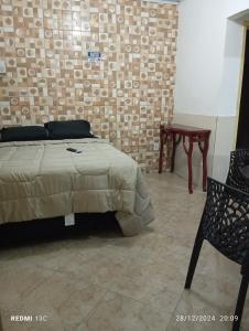 En eller flere senge i et værelse på Loft da Praia