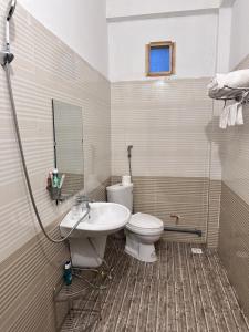 a bathroom with a toilet and a sink at Ta Phin Stone Mountain Homestay in Sa Pa +62 photos