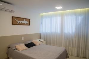 Postel nebo postele na pokoji v ubytování Guarapari Bacutia Peracanga an9