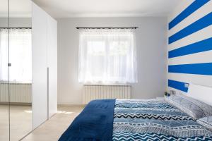 Ένα ή περισσότερα κρεβάτια σε δωμάτιο στο Indigo Blue Cannobio