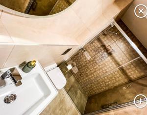 a bathroom with a sink and a shower at Apartmán Esprit Y31 in Dolný Kubín +74 photos