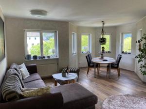a living room with a couch and a table at Ferienwohnung Alexa an der Dhron in Neumagen-Dhron
