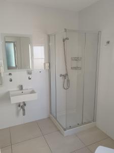 a bathroom with a shower and a sink at Magnolia Guest House in St. Julianʼs +45 photos