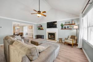 a living room with a couch and a fireplace at Sawgrass Cottage 3BR w Deck in Columbia