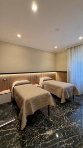 2 posti letto in una camera d'ospedale con di Bed and Breakfast Eritrea a Roma