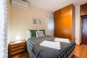 Ένα ή περισσότερα κρεβάτια σε δωμάτιο στο A casa do Gi - 1
