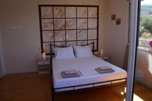 Postel nebo postele na pokoji v ubytování Sea And Sun apartments 304 Ιδιωτικό διαμέρισμα