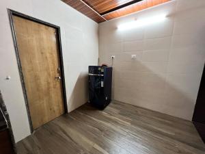 an empty room with a door and a basketball hoop at Shree Balaji Natures lap villa in Mirya