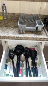 a drawer filled with utensils in a kitchen at Casa Aeroporto Premium Conforto e Conveniência para Sua Estadia in Campo Grande