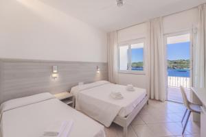 Postel nebo postele na pokoji v ubytování Hotel Dino