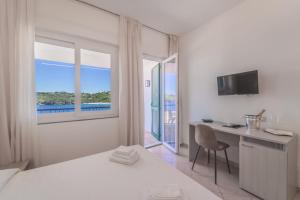Postel nebo postele na pokoji v ubytování Hotel Dino