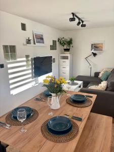 TV a/nebo společenská místnost v ubytování Apartmány Faunapark