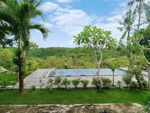 a view of the pool from the house at Green Sunrise Hill View in Nusa Penida