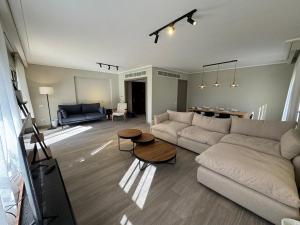 a living room with a couch and a table at The Pyramid Escape in Cairo