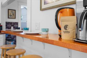 a coffee pot sitting on a counter in a kitchen at The Grand on Garden in Coeur d'Alene