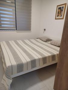 Ένα ή περισσότερα κρεβάτια σε δωμάτιο στο Apartman LaLa Land Ravna Planina
