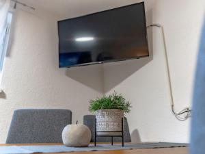 a living room with a tv hanging on a wall at Apartment Süta Ötztal by Interhome in Sautens