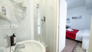 Postel nebo postele na pokoji v ubytování Nautilus Hotel