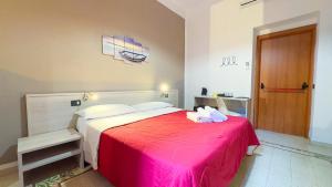 Postel nebo postele na pokoji v ubytování Nautilus Hotel
