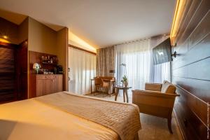Postel nebo postele na pokoji v ubytování Hôtel Diana Dea Lodge & SPA