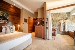 Postel nebo postele na pokoji v ubytování Hôtel Diana Dea Lodge & SPA