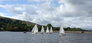 a group of small sailboats on a lake at Pheasant's Bank holiday cottage in Chapel en le Frith