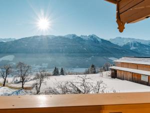 a view of a snow covered mountain from a cabin at Apartment Schoppengrub by Interhome in Mühlbach