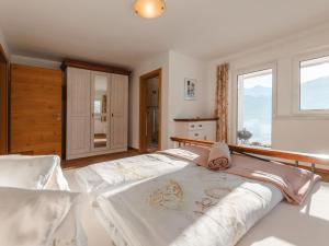 a bedroom with two beds and a window at Apartment Talmoosen-Bauer by Interhome in Dorf