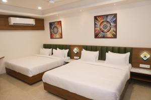 Giường trong phòng chung tại Soil to Soul Trinity Hotel - A Boutique Stay
