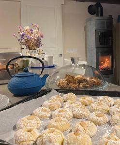 a bunch of donuts on a counter with a stove at Poderino - a place to feel in Cento +59 photos