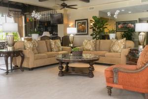 a living room with couches and a table at Comfort Suites Paradise Island in Nassau